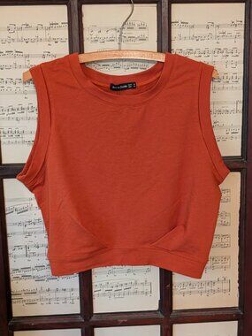 Orange crop athletic top, size medium. brand is Arrive Guide